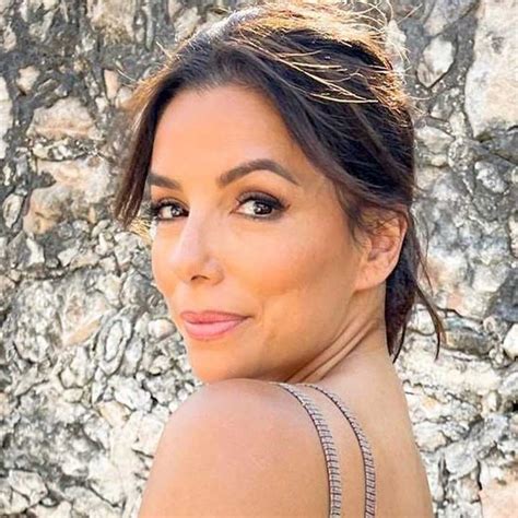 Eva Longoria is a beach goddess in barely